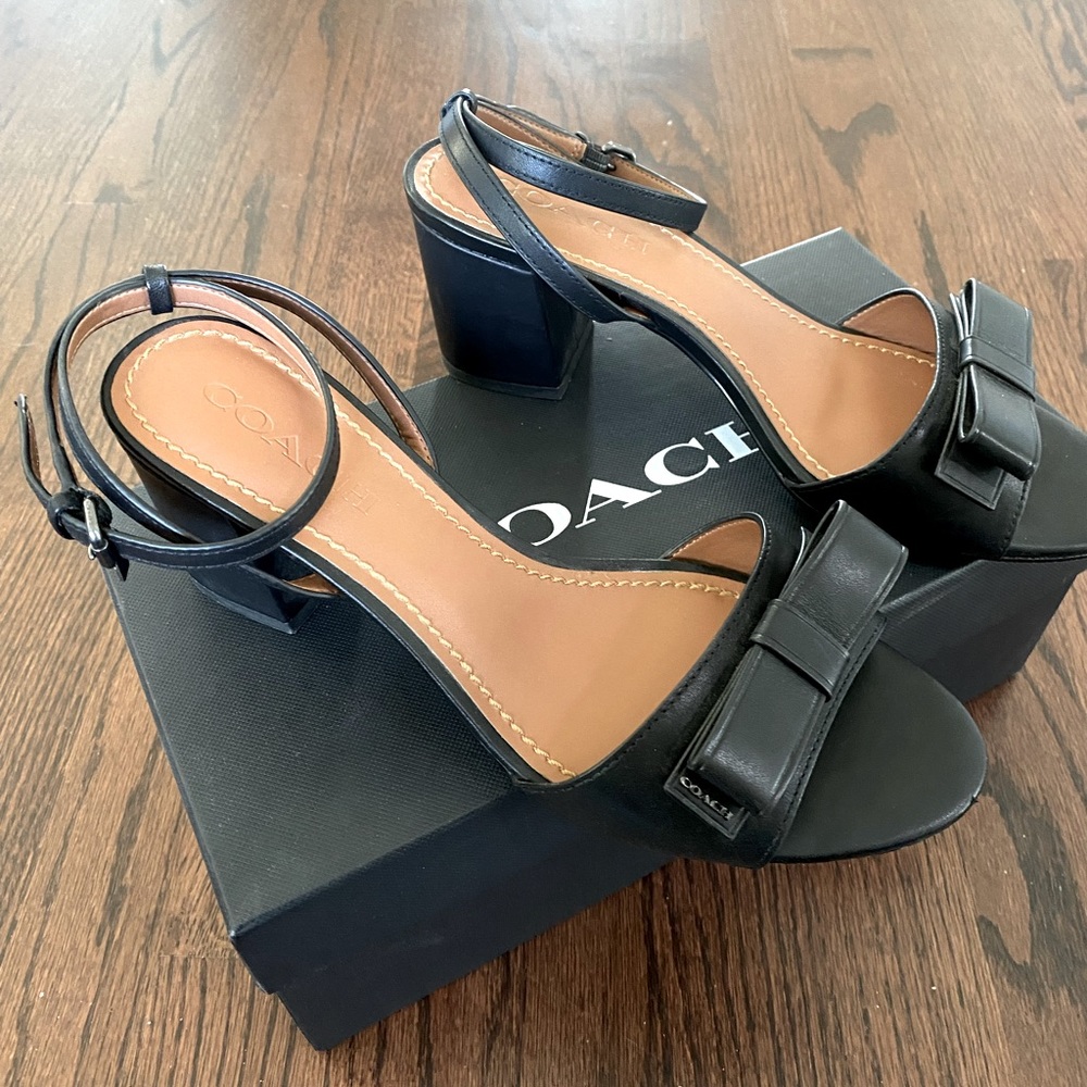 Coach size 8.5  leather black stack heel sandals with ankle buckle strap.